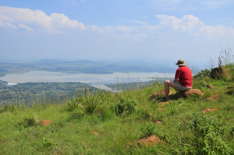 John contemplating the battle - an overflowing Spioenkop dam far below