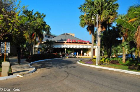The entrance road to Sol Palmeras Hotel winds through lush tropical gardens